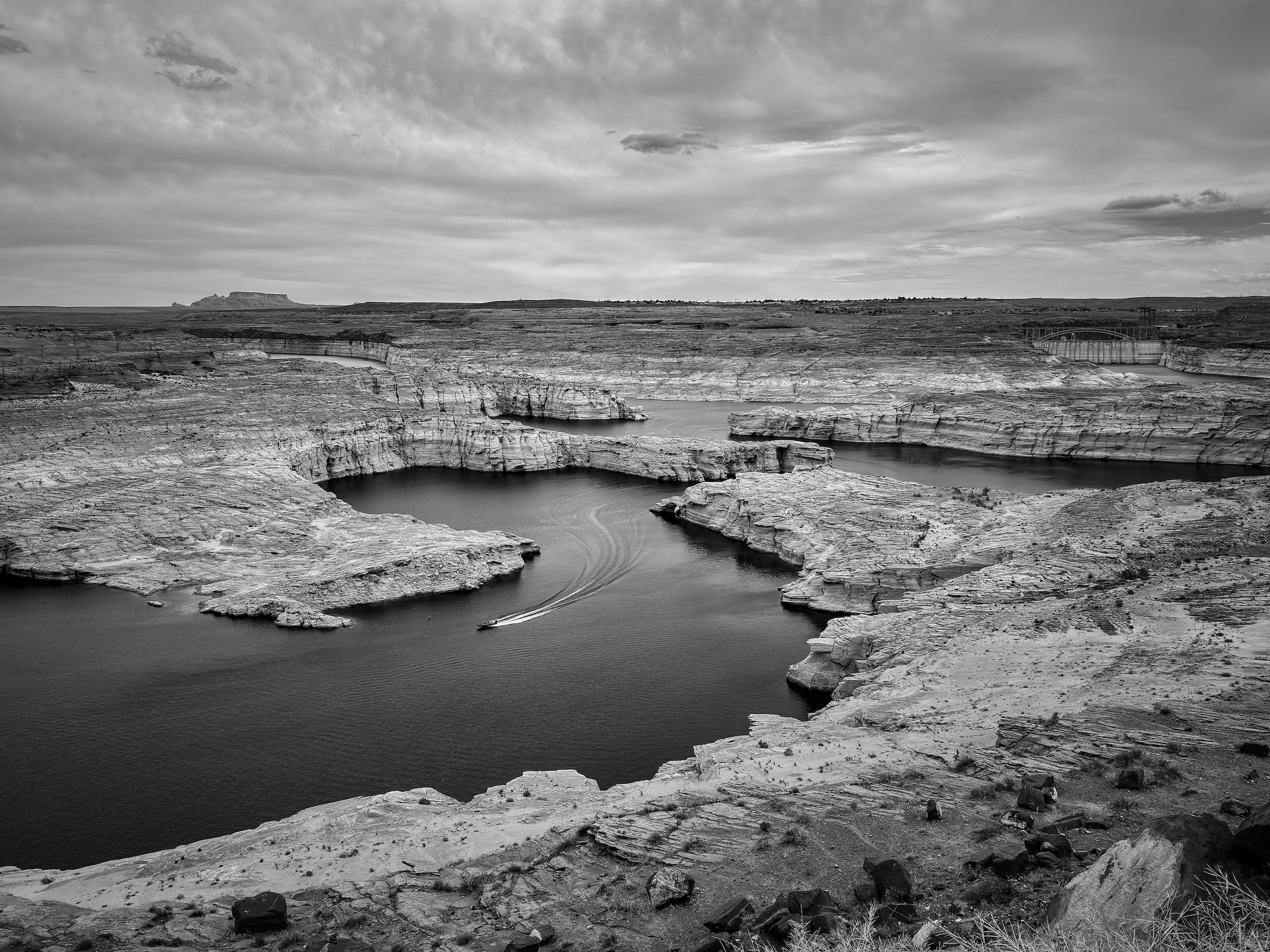 A boat on dry ground near Glen Canyon Dam and Lake Powell.